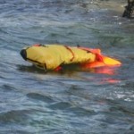 life raft inflating in the water