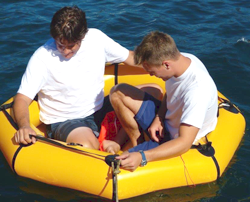 two people in revere coastal life raft